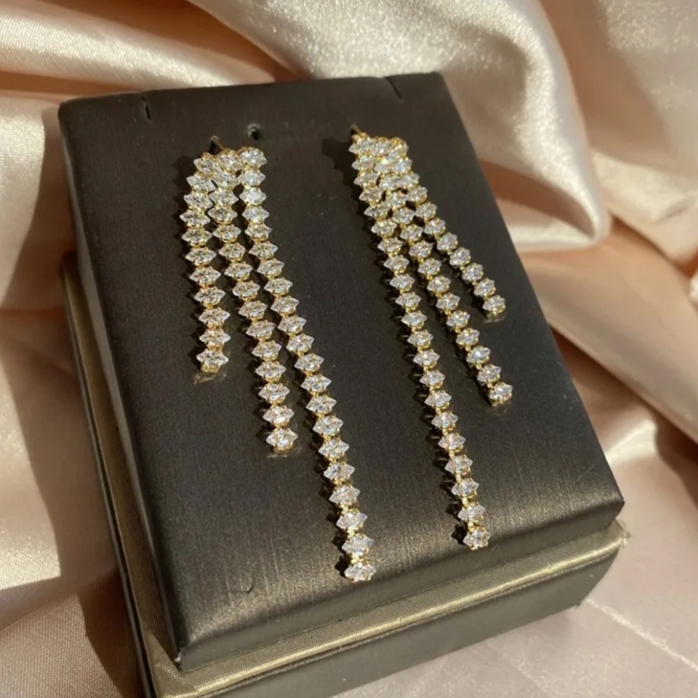 Zircon Golden toned Tassel Earrings